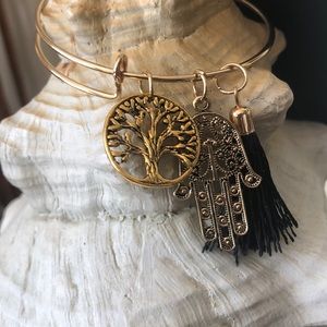 Adjustable gold tone bracelet w/tassel, tree,hamsa